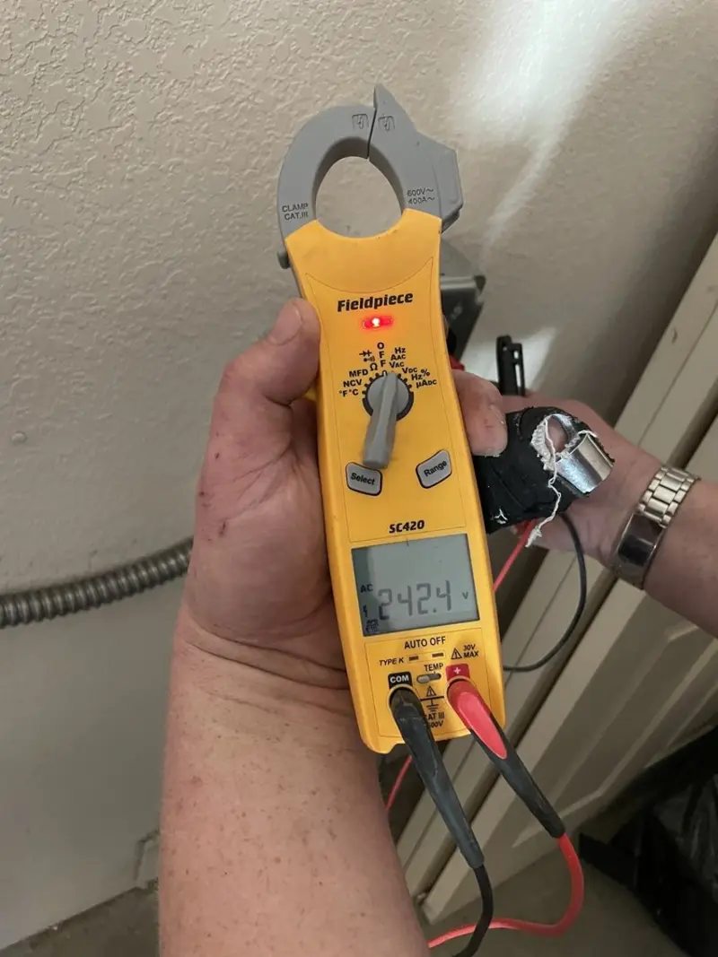 Voltage testing with clamp meter during Electrical Installation Services in Ottawa